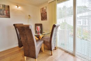 Dining area with patio doors to raised decking- click for photo gallery